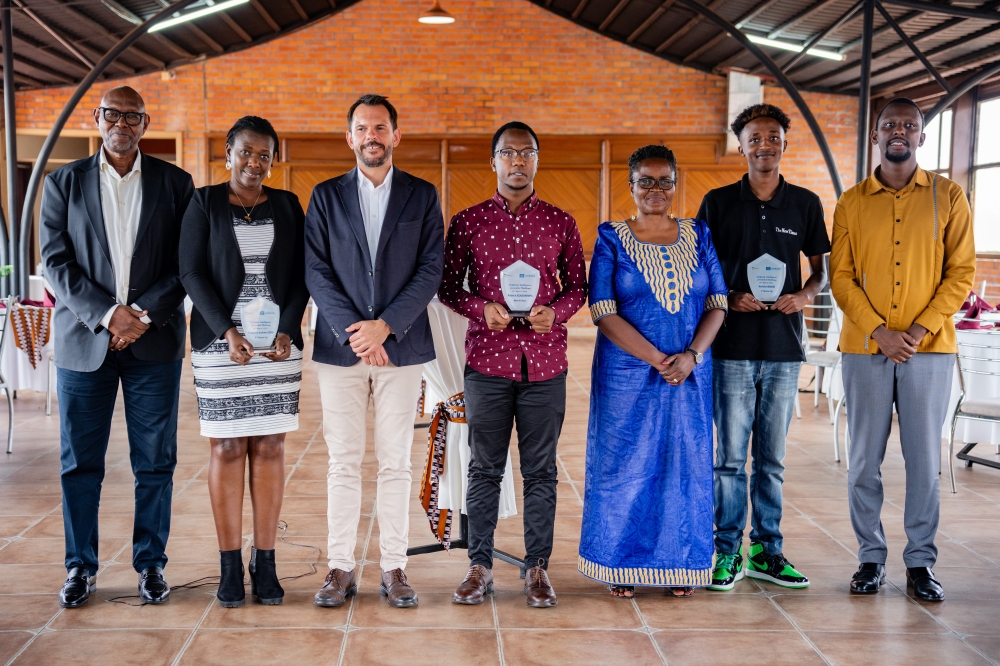 Heritier Bahizi and Patrick Nzabonimpa pose for a photo with representatives of GiZ, UNESCO, MINICT and Afrimedia during the awarding ceremony on March 26 at Hotel Sainte Famille.