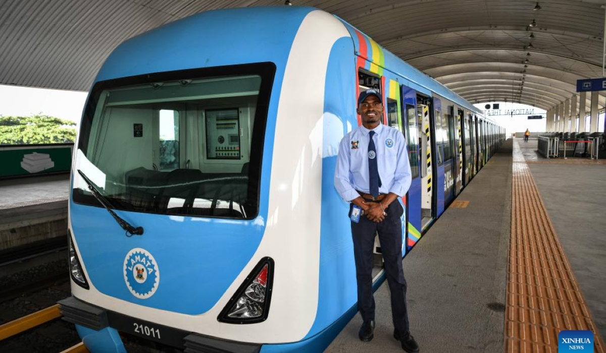 A local driver is pictured beside a train of the Lagos Rail Mass Transit (LRMT) Blue Line in Lagos, Nigeria, March 2, 2024. (Xinhua/Han Xu)