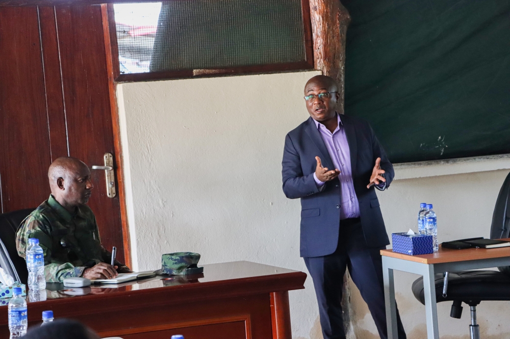Rwanda’s High Commissioner in Mozambique, Donath Ndamage, speaks to the troops as the Rwanda Security Forces Joint Task Force Commander, Maj Gen Alex Kagame, listens during the former’s one-day visit to Mocimboa da Praia on Wednesday, March 27. Courtesy
