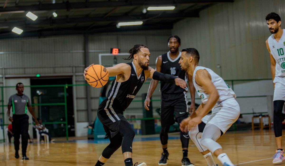 Dixon tries to dribble past an Al Ittihad Alexandria opponent during a past friendly game. The two will become teammates after the American completed his move to the Egyptian side earleir this week-Dan Gatsinzi 