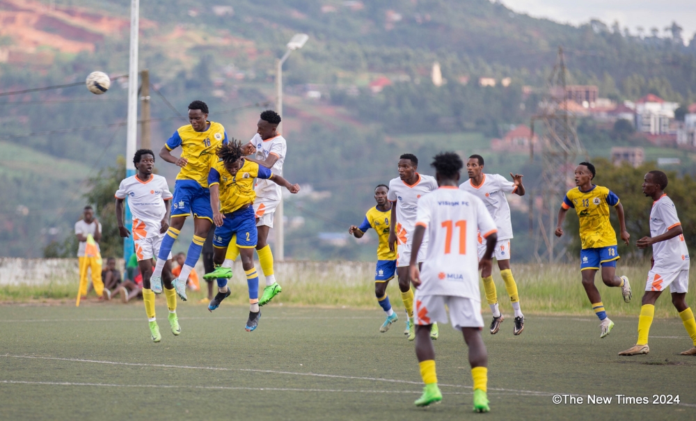 Vision FC and AS Muhanga players vie for the balll during a 1-0 second league tie at Mumena Stadium on Saturday, March 30. All Photos by Craish Bahizi