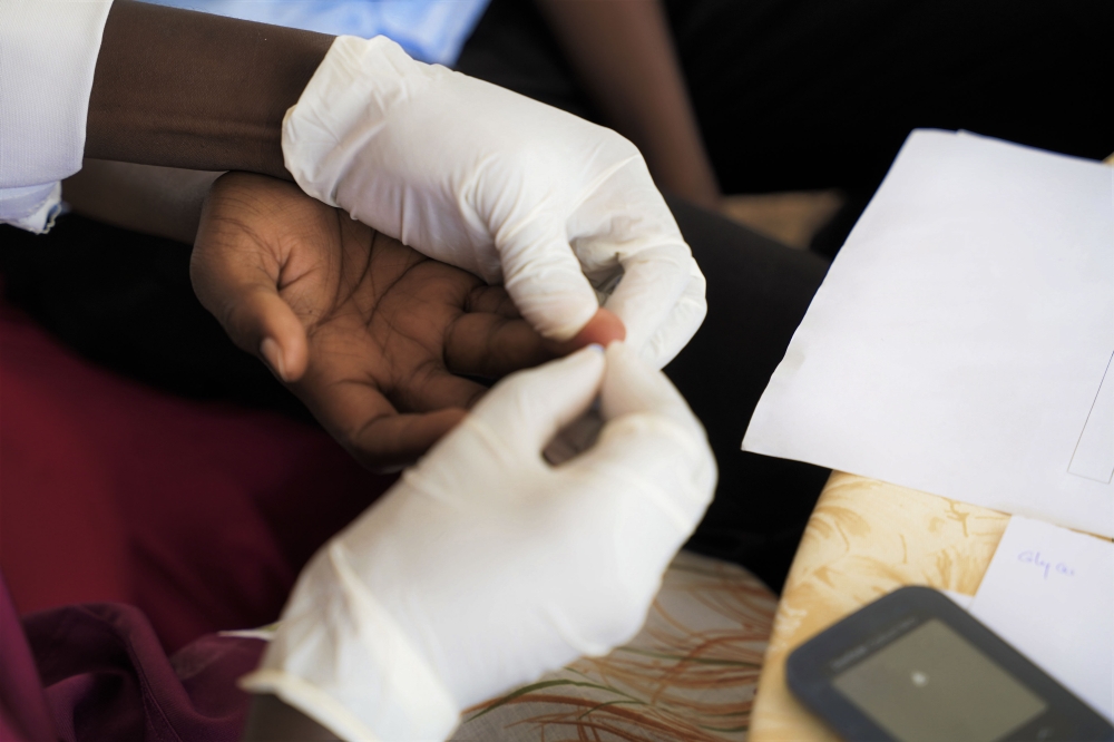 A resident undergoes HIV test in Kigali. Kunda (not real name), a young woman living with HIV, had a job opportunity outside of Rwanda, but lost it due to being HIV positive. Craish Bahizi