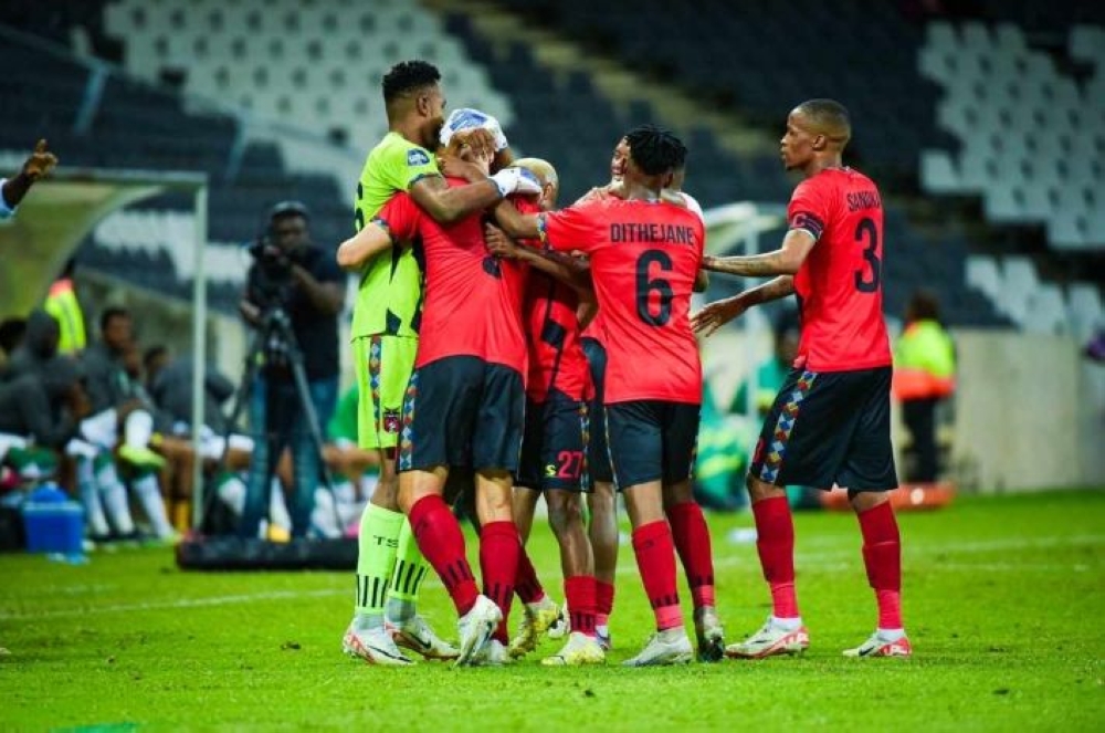 TS Galaxy players mob Goalkeeper Fiacre Ntwari following his great display in their 2-0 win over Amazulu.