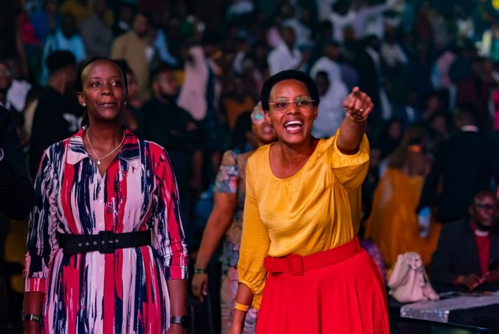 Revelers sing with Mbonyi during his performance. 