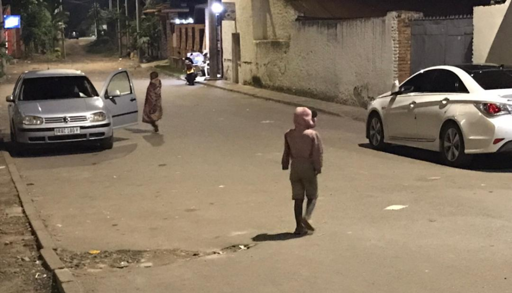 School-age children in Rubavu town spotted begging from cars at night. Photo by Germain Nsanzimana