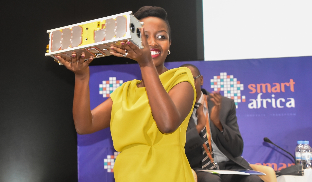 Paula Ingabire, the Minister of ICT and Innovation, holds Rwanda’s satellite’ RWASAT-1 during the conference in Kigali on May 16, 2019. The country’s space ambitions have attracted interest from countries such as Japan, Israel, and the United Arab Emirates. Photo: File.