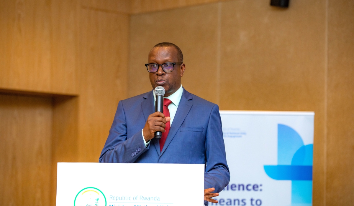 The Minister of National Unity and Civic Engagement (MINUBUMWE) Jean Damascene Bizimana addresses delegates during the release of the new study in Kigali. Courtesy