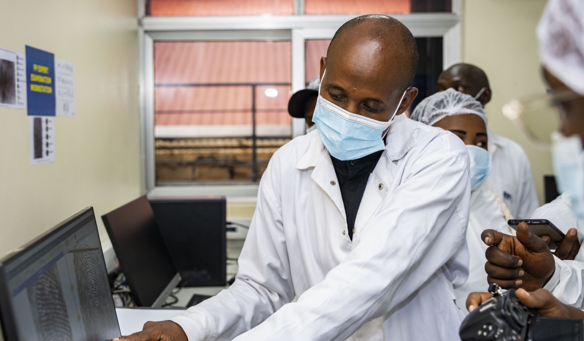 A specialist shows visitors how Rwanda Forensic Institute can detect deepfakes during a guided tour on September 7, 2023. Photo: Emmanuel Dushimimana.