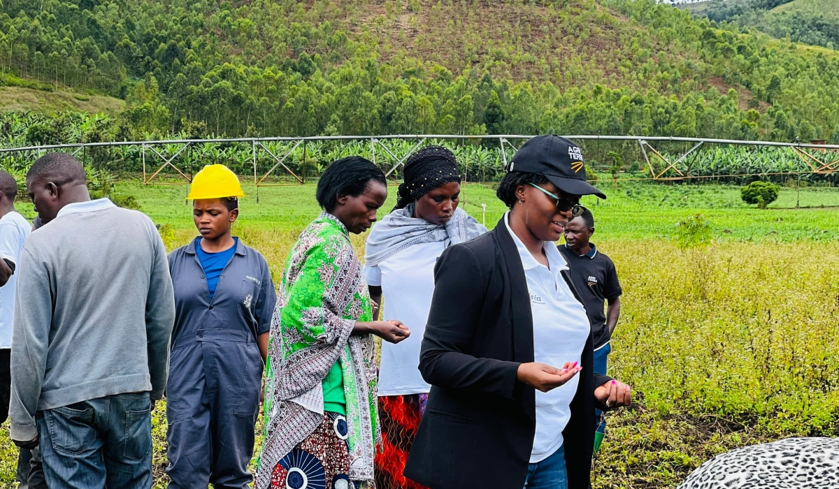 Marine Umukunzi SDGP Maize Project Manager at Agriterra (in front) with KABOKU cooperative farmers,  plant maize seeds in demo plots for minimum tillage trial, in Umuvumba Umuvumba valley, in Nyagatare District, on April 3.