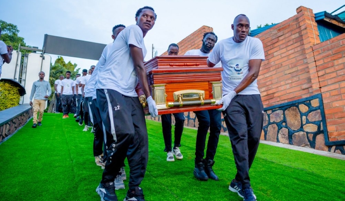 APR FC players carry the body of Late Zrane during the event to bid farewell on Friday, April 5