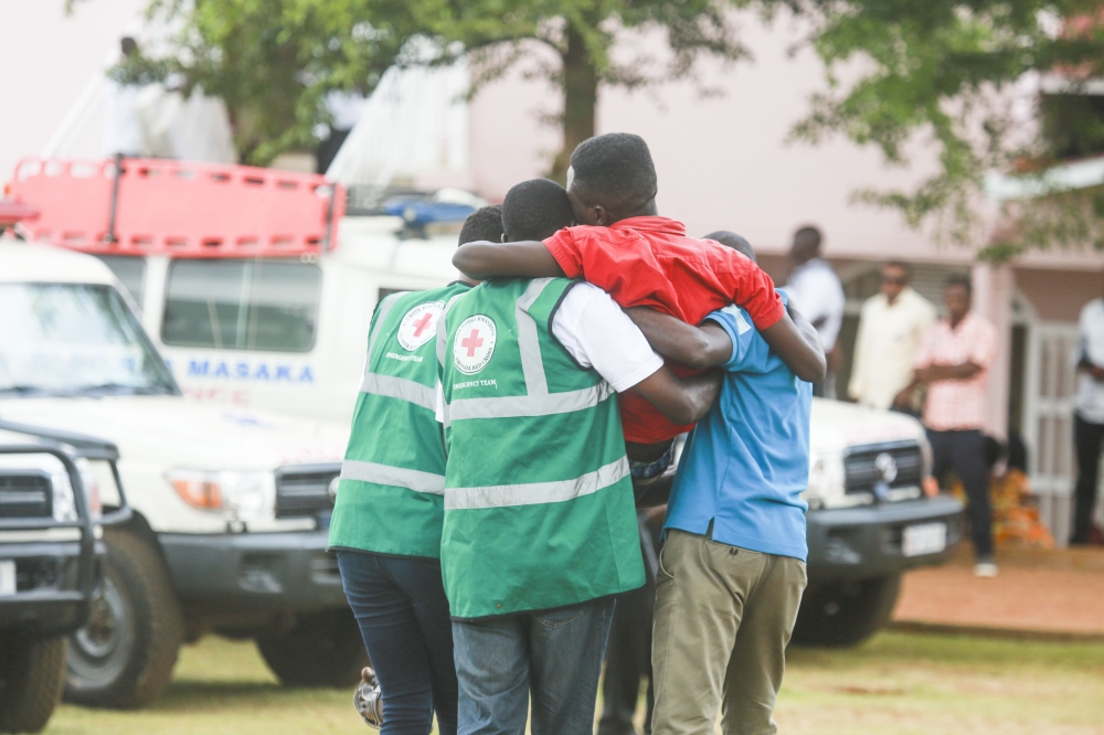 Red Cross volunteers help a trauma victim during a commemoration event at Kicukiro-Nyanza Genocide Memorial in 2019. Sam Ngendahimana