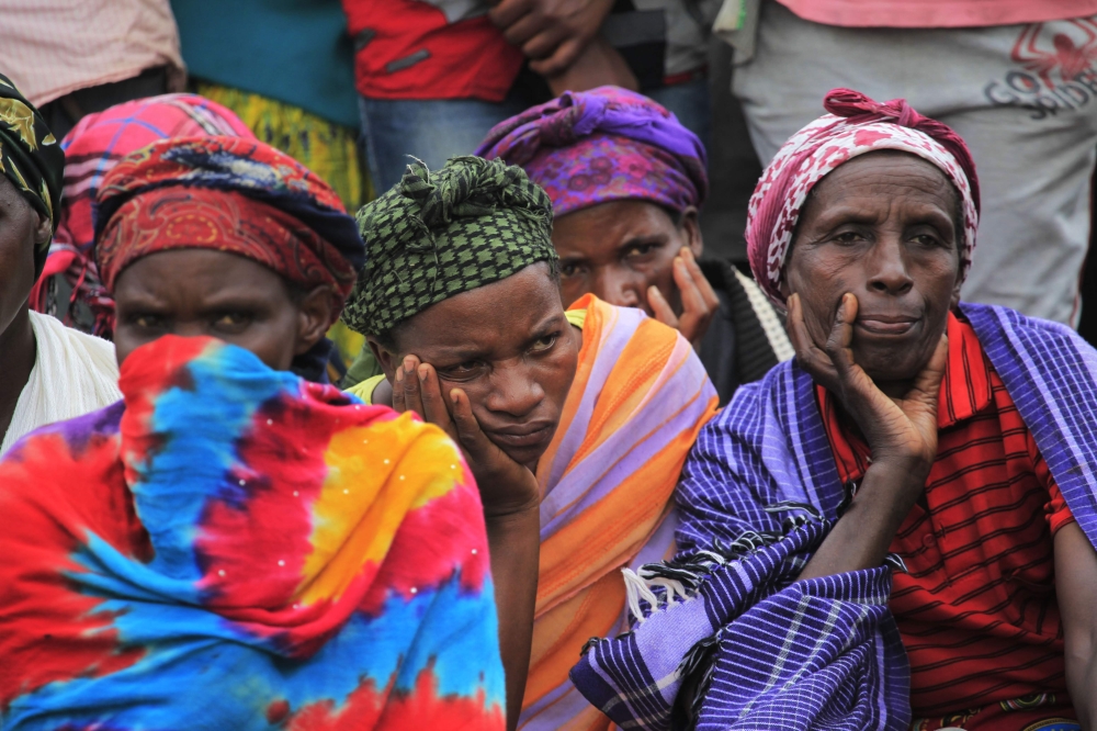 Mourners listen to Suzan Nyiranyamibwa&#039;s song &#039;Ayii Ngirente&#039; during the commemoration at Murambi Genocide Memorial. Photo by Sam Ngendahimana
