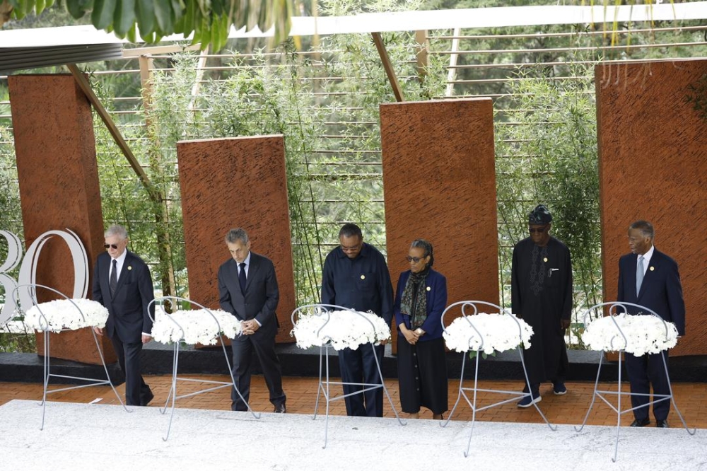 Former heads of state and government observe a moment of silence to pay tribute to victims at Kigali Genocide Memorial on April 7. Photo by  Olivier Mugwiza