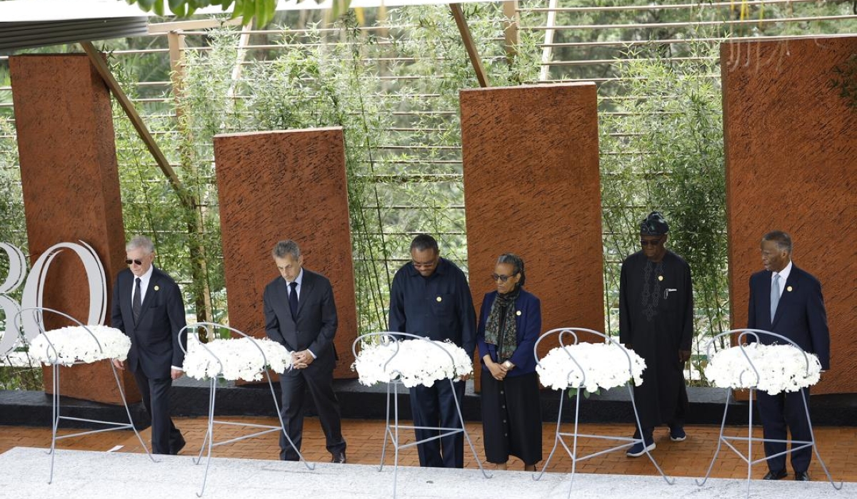 Former heads of state and government observe a moment of silence to pay tribute to victims at Kigali Genocide Memorial on April 7. Photo by  Olivier Mugwiza