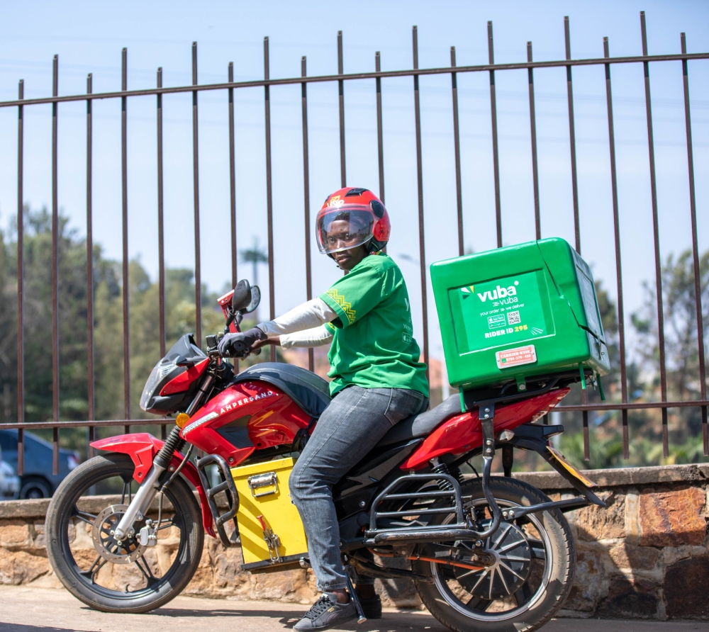 A female taxi rider who works at Vuba Vuba Africa, one of the leading e-commerce delivery companies in Rwanda. Photo by Dan Gatsinzi