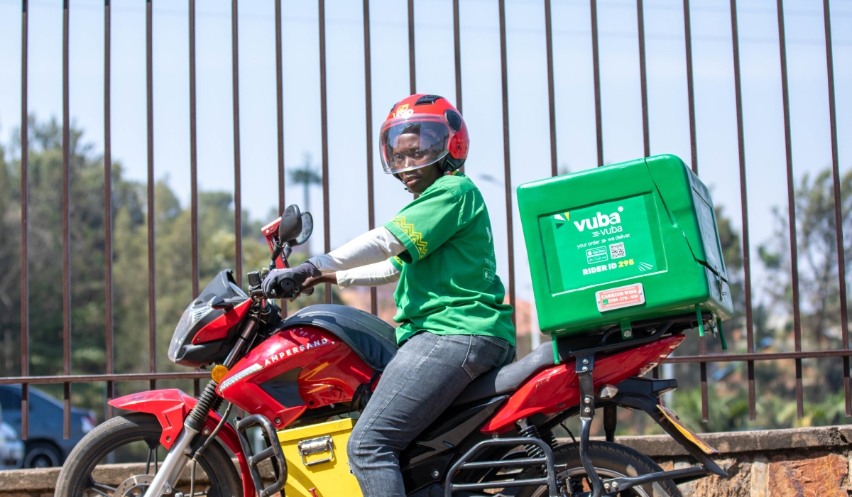 A female taxi rider who works at Vuba Vuba Africa, one of the leading e-commerce delivery companies in Rwanda. Photo by Dan Gatsinzi