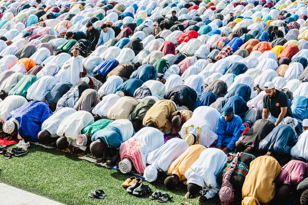 Thousands of Muslims gathered at Kigali Pele Stadium as early as 6:30 for Eid prayers. PHOTOS BY WILLY MUCYO