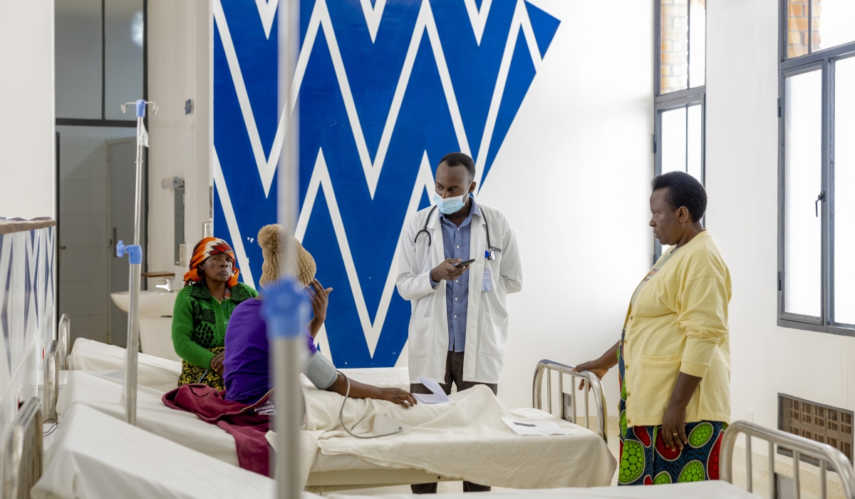 Patient having a conversation with a doctor at Munini Hospital in Nyaruguru district.