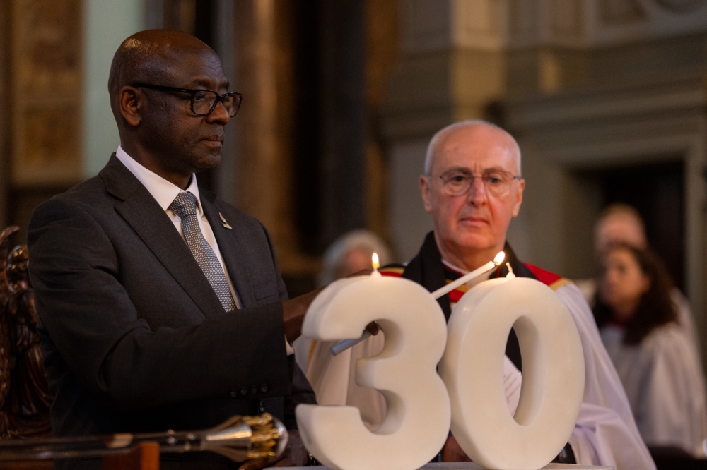 Rwanda’s High Commissioner to the UK, Johnston Busingye, lights a candle in remembrance of the innocent lives lost during the 1994 Genocide against the Tutsi.