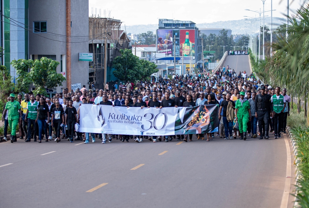 Thousands of mourners during a solemn walk from IPRC-Kigali to Nyanza Genocide Memorial in Kicukiro District as part of the 30th commemoration of the Genocide against the Tutsi on Thursday April 11. PHOTOS BY DAN GATSINZI