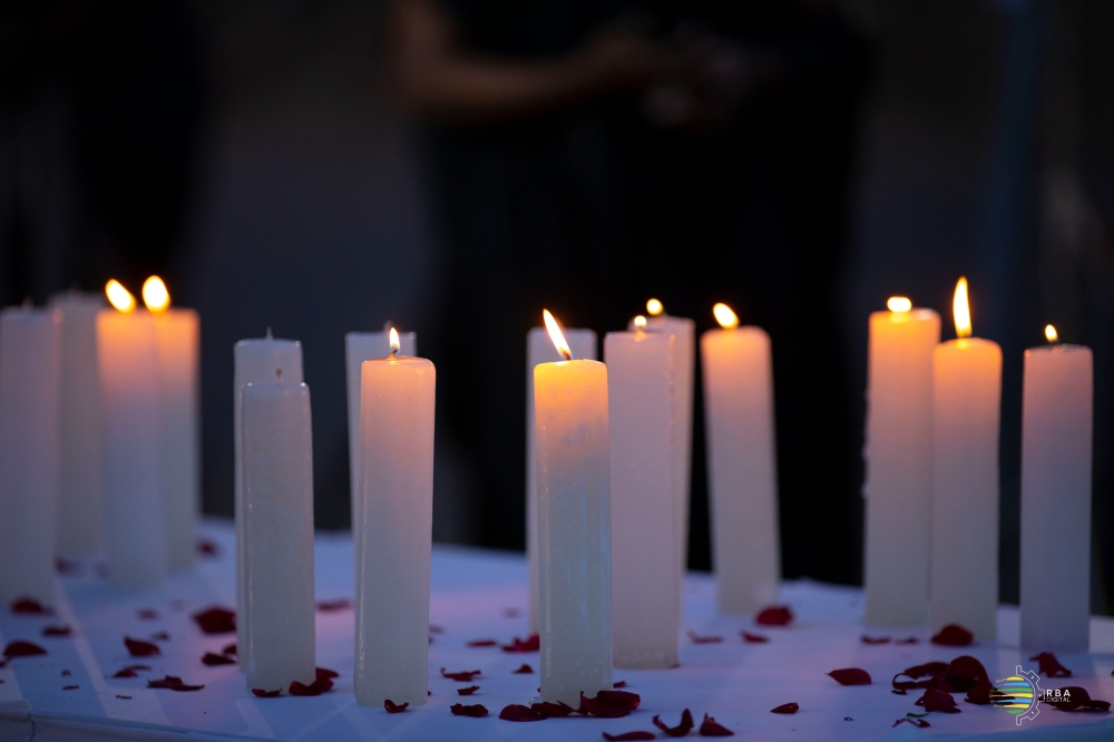 Lit candles as members of Rwandan media fraternity commemorated journalists killed in the 1994 Genocide against the Tutsi on Friday, April 12. Photo Courtesy