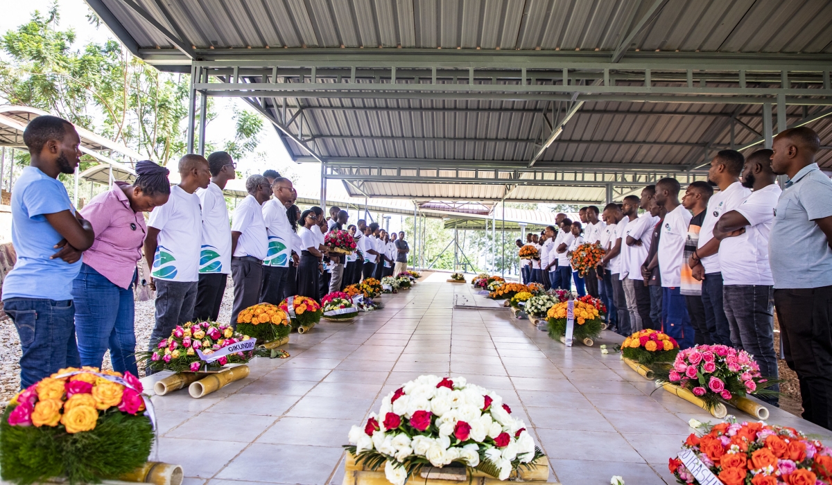 Management and staff of  NETIS Rwanda,  observe a moment of silence to pay tribute to the victims of the 1994 Genocide at Nyanza-Kicukiro  Genocide Memorial on April 12. Photos by Emmanuel Dushimimana