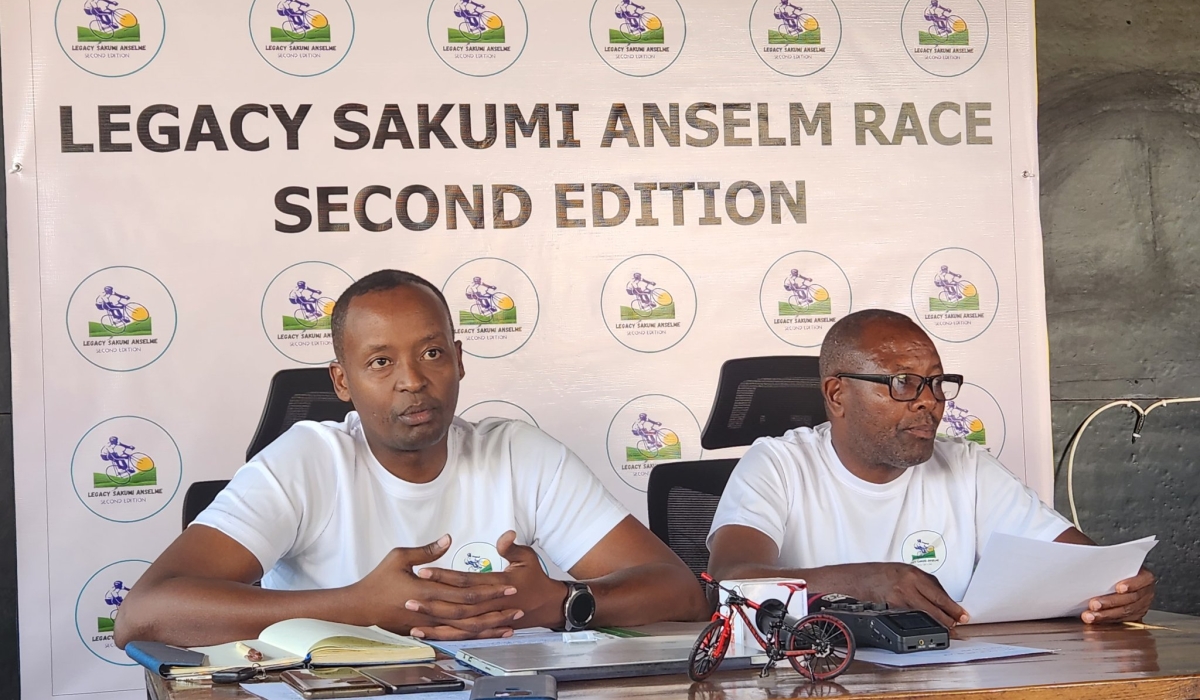 Serge Rusagara Sakumi, (L) addresses journalists during a press conference ahead of a cycling competition to remember his father Anselme Sakumi in 2023. File