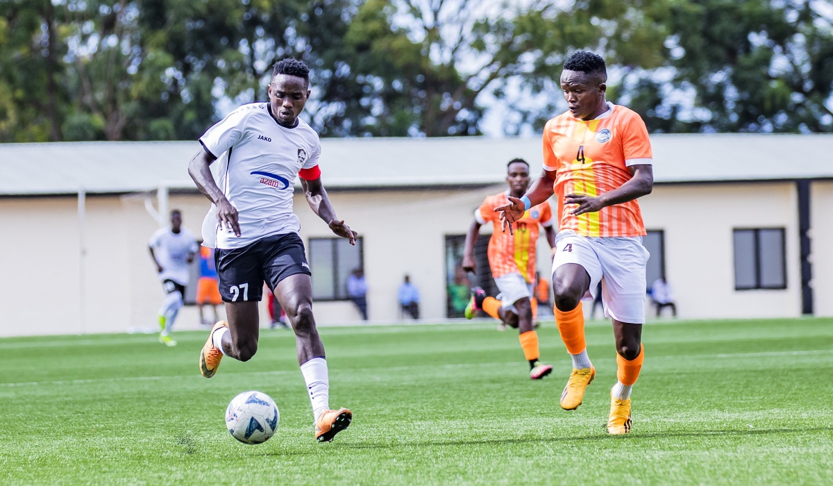 APR FC captain Jean Bosco Ruboneka controls the ball against  AS Kigali player Aimable Rucogoza  during a 2-2 draw at Kigali Pele Stadium on Monday, April 15. Photo by Emmanuel Dushimimana