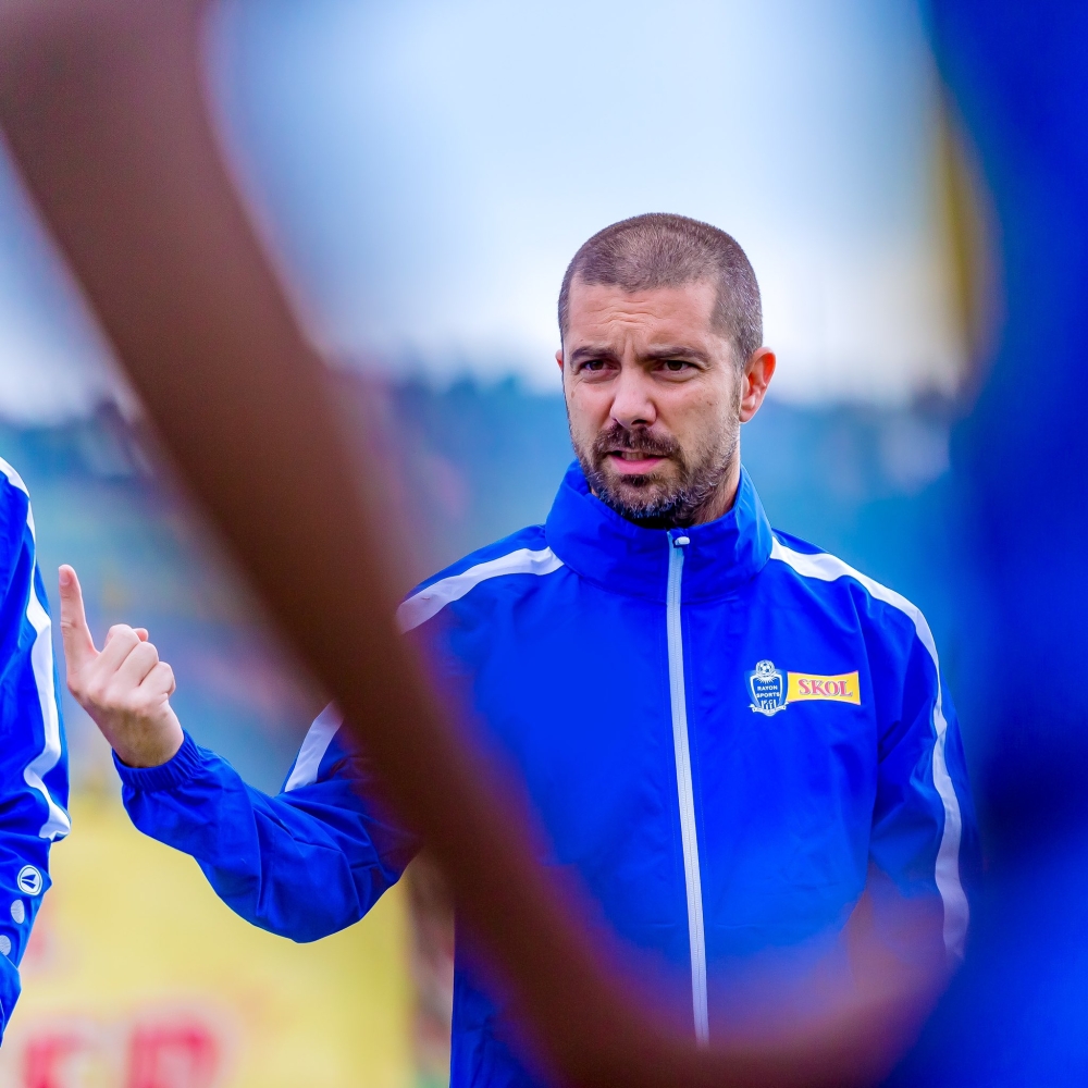 Rayon Sports FC head coach Julien Mette gives instructions ti his players during a training session at Nzove stadium. Courtesy