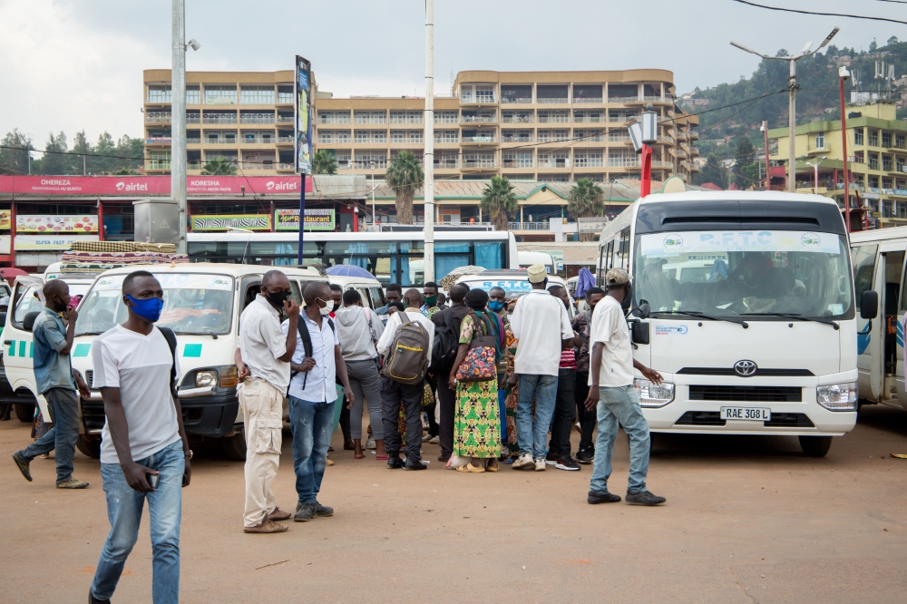 Passengers board buses at Nyabugogo taxi park. Private bus operators have expressed frustration over the delayed government’s disbursement of transport subsidies. Photo by Craish Bahizi