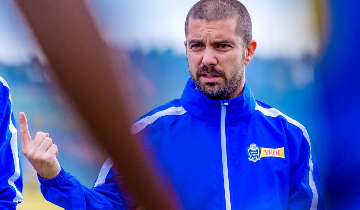 Rayon Sports FC head coach Julien Mette gives instructions ti his players during a training session at Nzove stadium. Courtesy