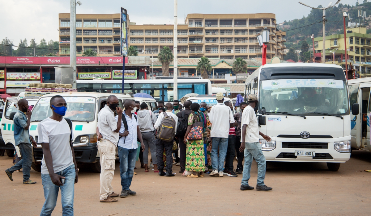 Passengers board buses at Nyabugogo taxi park. Private bus operators have expressed frustration over the delayed government’s disbursement of transport subsidies. Photo by Craish Bahizi