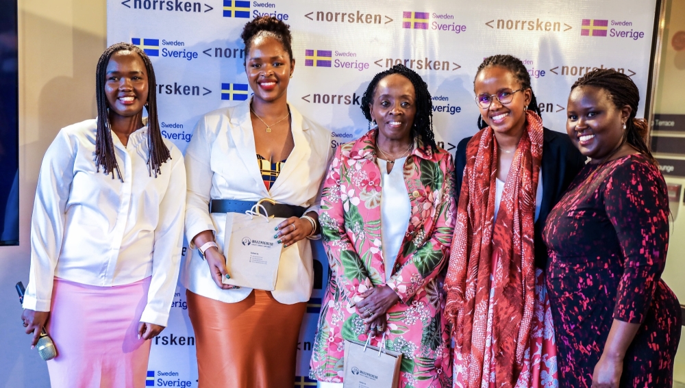 Officials pose for a photo during the launch of the second cohort of 15 female enterpreneurs. All photos by Craish Bahizi