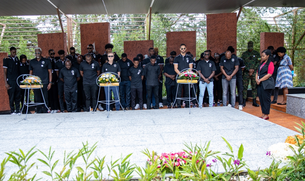 APR Basketball Club players, coaches and staff observe a moment of silence to pay tribute to victims at  Kigali Genocide Memorial Centre  on Thursday, April 18. Photos by Dan Gatsinzi