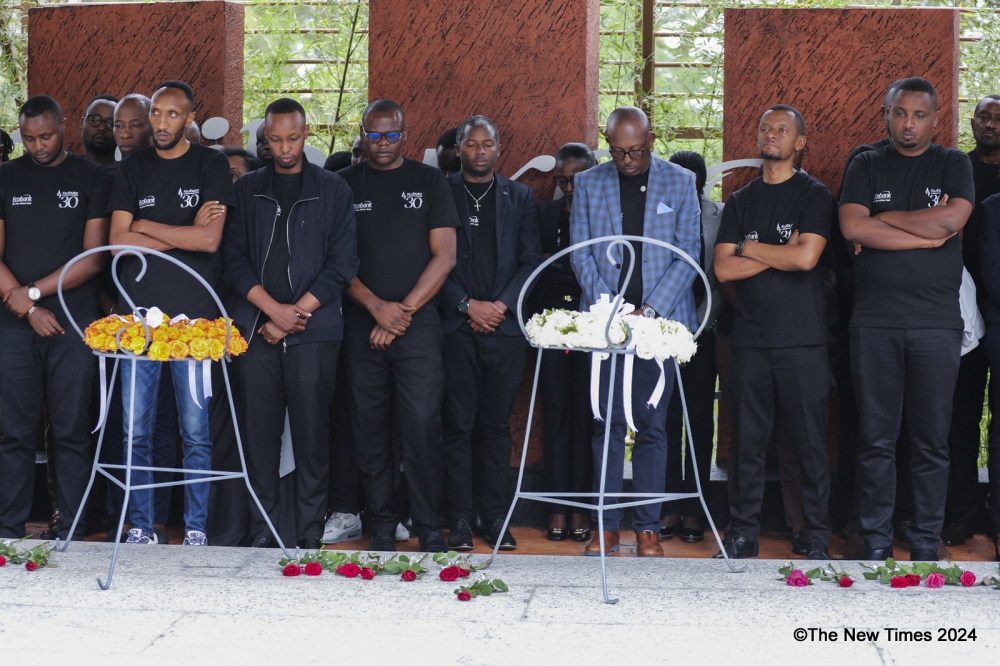 Mourners observe a moment of silence to pay tribute to victims at Kigali Genocide Memorial on Wednesday, April 17. Craish Bahizi