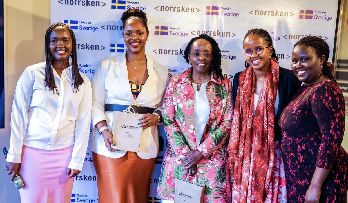 Officials pose for a photo during the launch of the second cohort of 15 female enterpreneurs. All photos by Craish Bahizi