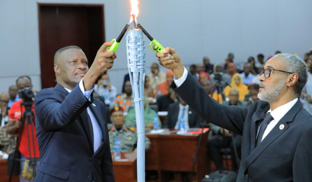 Charles Karamba the Ambassador  of Rwanda and Ali Hassan Bahdon, Minister of Justice of Djibouti  light the Flame of Remembrance during the commemoration of the 1994 Genocide against the Tutsi, in Djibouti on Thursday, April 18. Courtesy