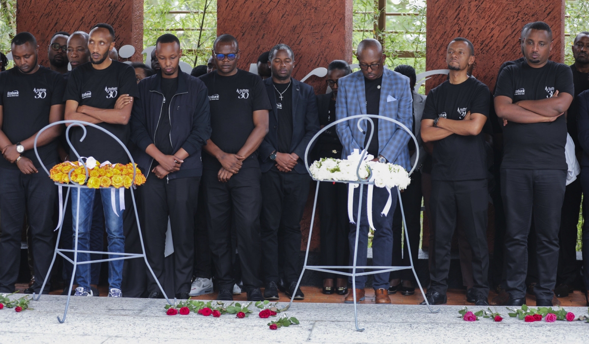 Mourners observe a moment of silence to pay tribute to victims at Kigali Genocide Memorial on Wednesday, April 17. Craish Bahizi