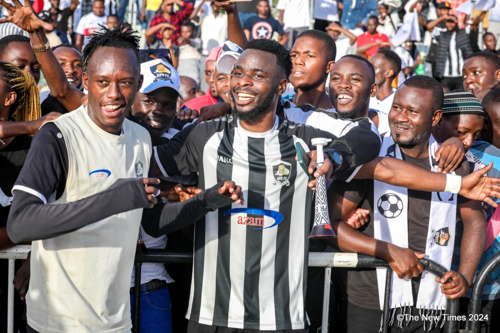 APR FC  goal scorer Gilbert Mugisha with the supporters as they celebrated the winger&#039;s  lone goal against  Kiyovu SC that enabled the Army side to win Rwandan league title on Saturday, April 20. All Photos by Craish Bahizi