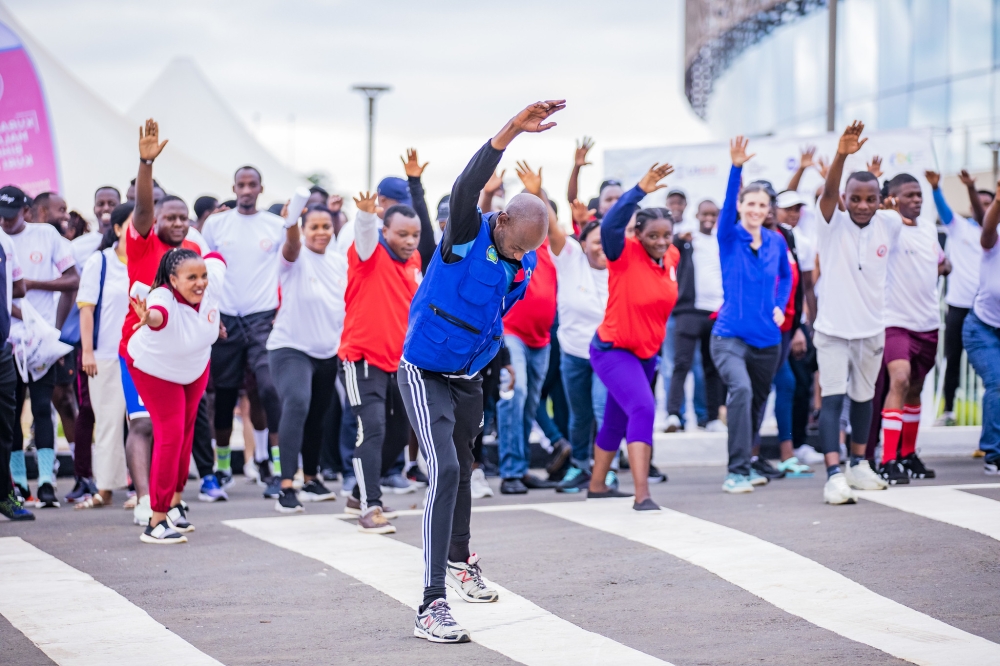 Participants stretch their bodies during Kigali Car Free Day mass sports on Sunday, April 21. Photos by Emmanuel Dushimimana