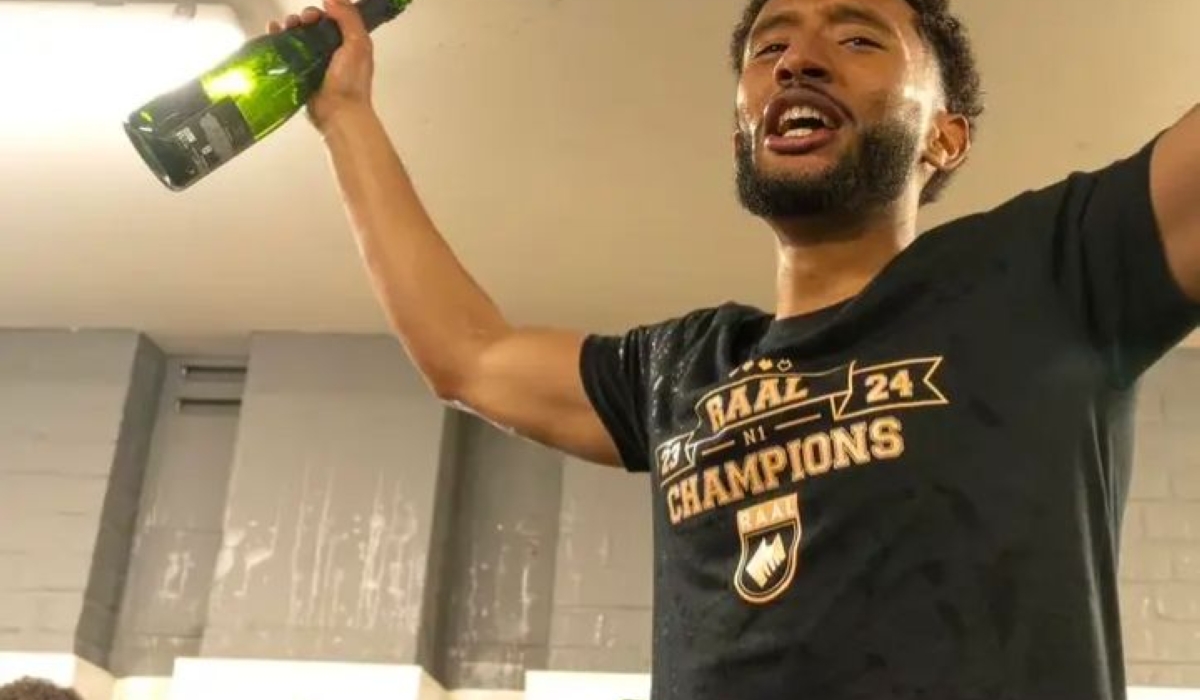 Talented midfielder Samuel Gueulette celebrates with a champagne in the dressing room after his club Raal La Louviere won the 2023/24  Belgian 1st National League.