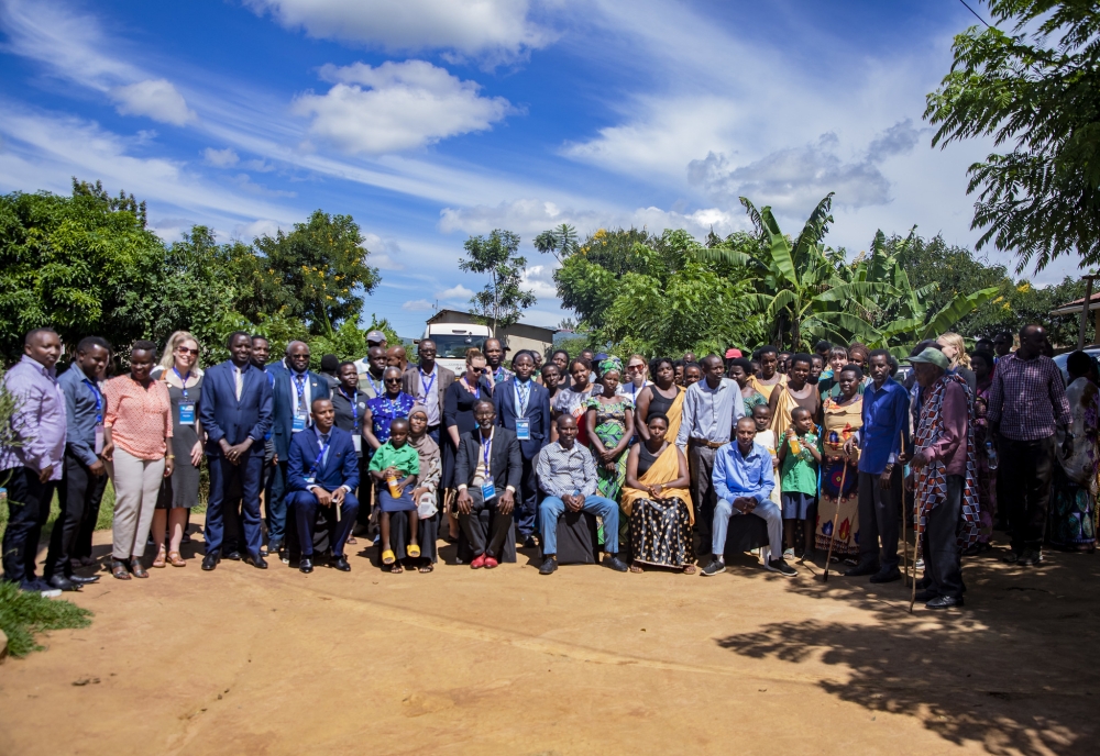University of Rwanda and Swedish researchers pose for a group photo with Genocide survivors and perpetrators who live peacefully in the same village
in Mayange Sector, Bugesera District, on Monday, April 22. Photo: Emmanuel Dushimimana.