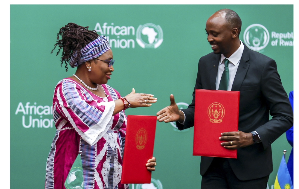 Dr Sabin Nsanzimana (R), the Rwandan Minister of Health, and Minata Samate Cessouma, the AU Commissioner for Health, Humanitarian Affairs, and Social Development, shake hands after signing a host agreement for the African Medicines Agency (AMA) in Kigali in June 2023. Photo by Olivier Mugwiza