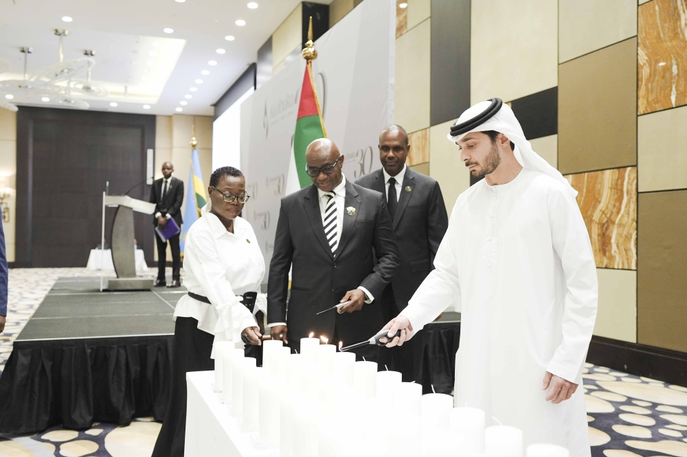Officials light candle as a symbol of hope for a better future during the commemoration event  in Abu Dhabi, on Sunday, April 21.  Courtesy