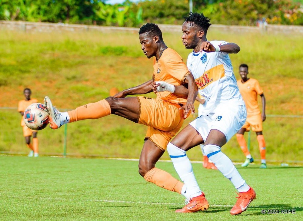 Bugesera FC  goal scorer  Stephen Bonney wins the ball against Rayon Sports player  as they stunned the Blues 1-0 during the Peace Cup game at Bugesera Stadium on Tuesay, April 23. Courtesy