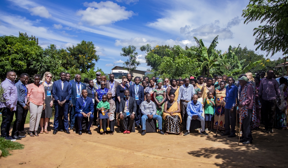 University of Rwanda and Swedish researchers pose for a group photo with Genocide survivors and perpetrators who live peacefully in the same village
in Mayange Sector, Bugesera District, on Monday, April 22. Photo: Emmanuel Dushimimana.