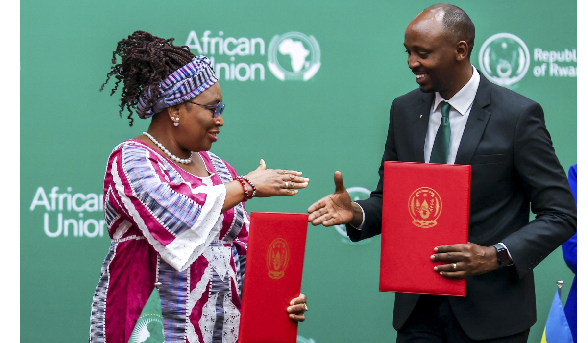 Dr Sabin Nsanzimana (R), the Rwandan Minister of Health, and Minata Samate Cessouma, the AU Commissioner for Health, Humanitarian Affairs, and Social Development, shake hands after signing a host agreement for the African Medicines Agency (AMA) in Kigali in June 2023. Photo by Olivier Mugwiza