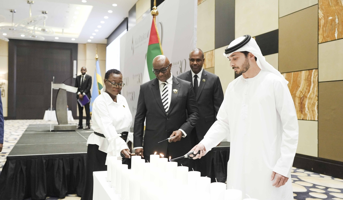 Officials light candle as a symbol of hope for a better future during the commemoration event  in Abu Dhabi, on Sunday, April 21.  Courtesy