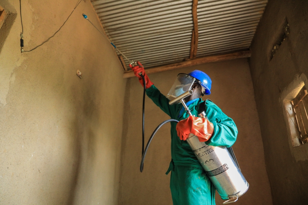 A health worker carries out indoor residual spraying in Bugesera District. According to Rwanda Biomedical Center (RBC), Malaria cases in the country dropped by 88 per cent as of 2023. Photo: File.