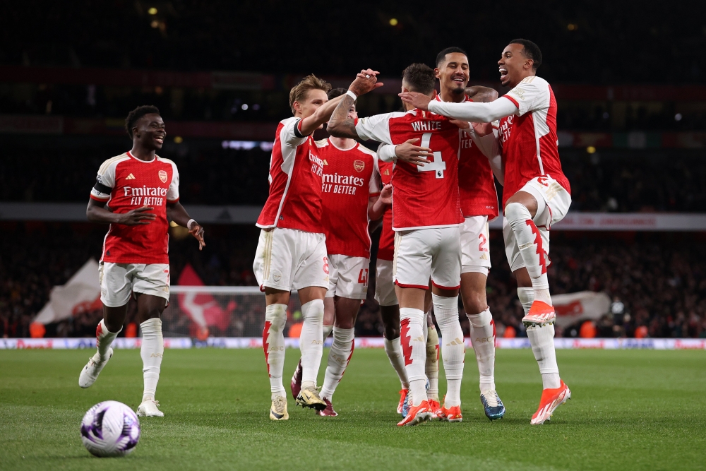 Arsenal players celebrate during the table leaders&#039; emphatic win over Chelsea. 